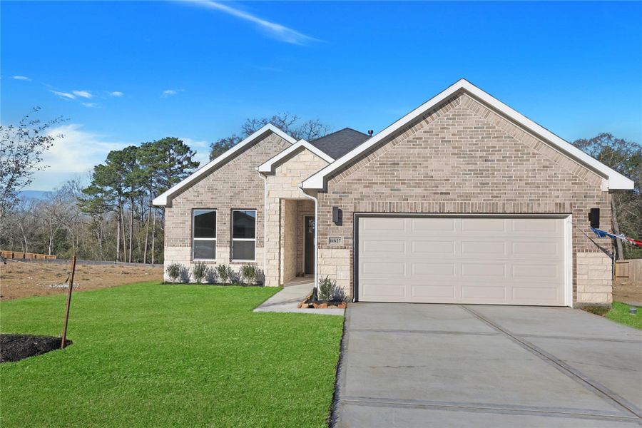 Front exterior of a new home in Lexington Heights, Willis, TX, highlighting curb appeal (Image 2). Front exterior of a new home in Lexington Heights, Willis, TX, highlighting curb appeal (Image 2).