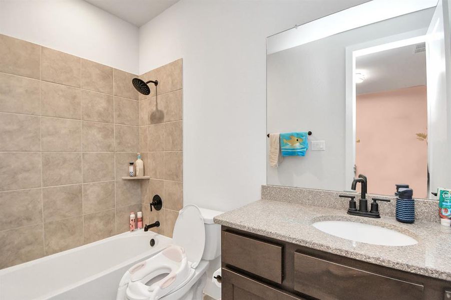 2nd full bathroom with a bathtub and sink.