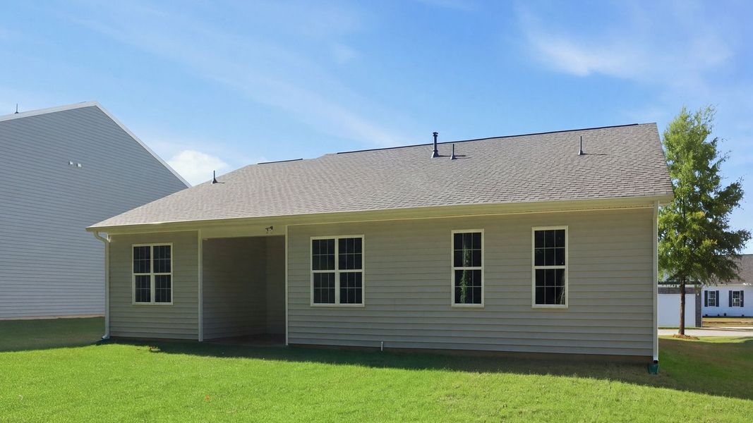 Exterior details and patio area of a home in Tyler - Home on the Lake, New Bern (Image 20).
