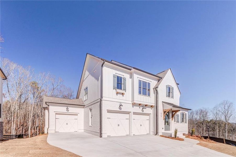 Front exterior of a new home in Malone's Pond, Ball Ground, GA, highlighting curb appeal (Image 22).