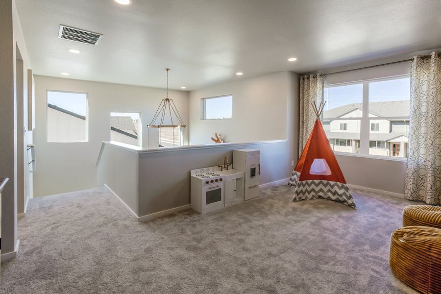 Representative furnished interior of a home built from the Rowling by Hartford Homes in Trailside, Timnath (Image 42).