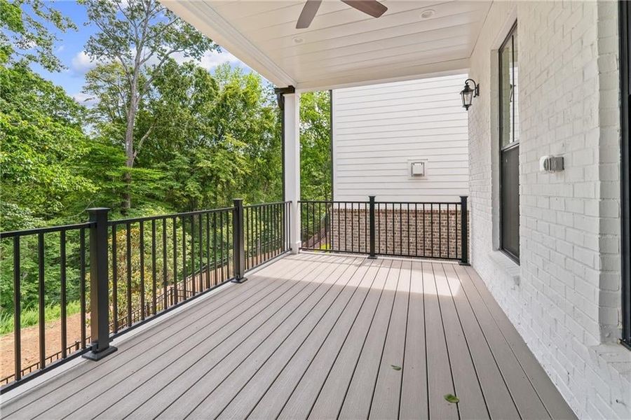 Deck off owners suite and family room. Not actual home.
