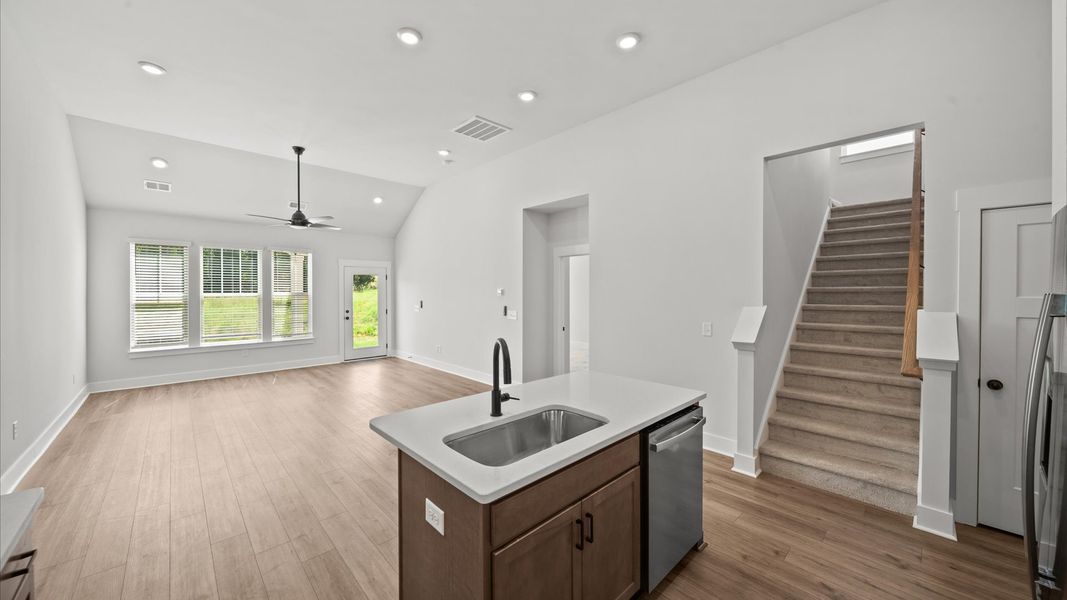 Accomplished kitchen layout with a compact island, perfect for prep and casual dining