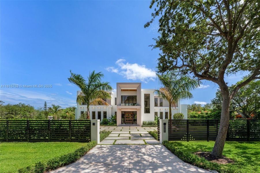 Front exterior of a new home in , Pinecrest, FL, highlighting curb appeal (Image 2).
