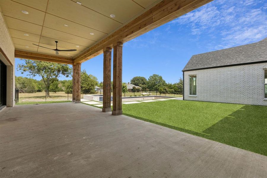 Luxurious modern designed pool and spa, covered patio, and central turf courtyard designed for all season entertainment.