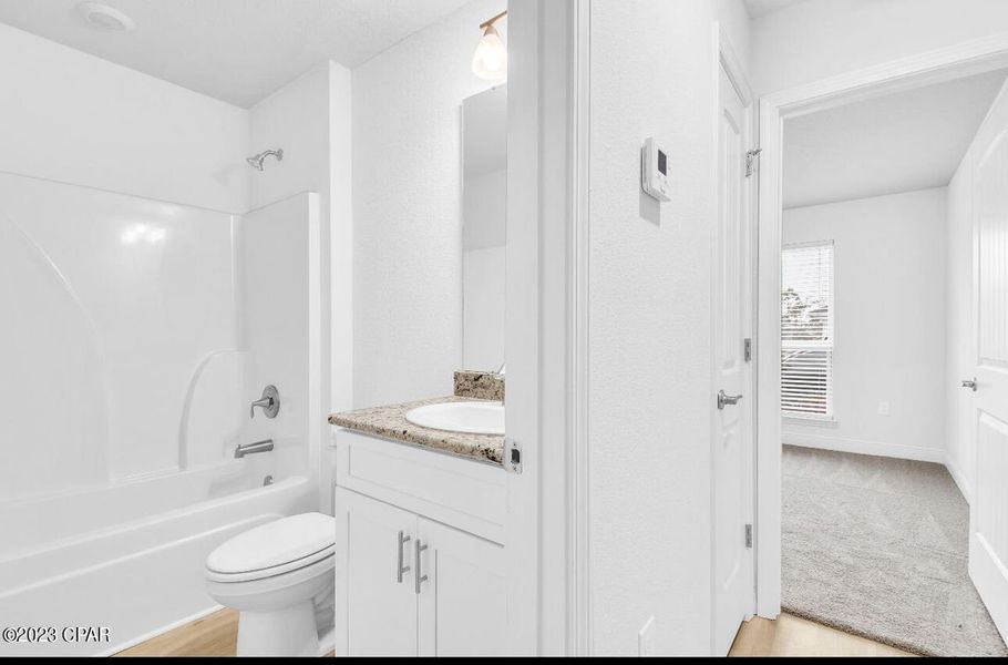 Representative furnished interior of a home built from the Plan 1520 by Adams Homes in East Bay, Panama City (Image 13).