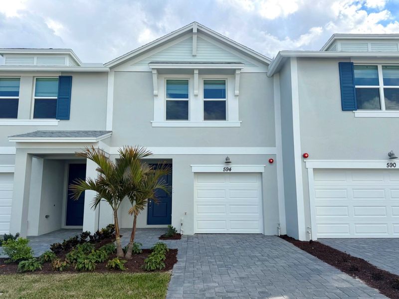 Front exterior of a new home in Tidewater, Fort Pierce, FL, highlighting curb appeal (Image 1). Front exterior of a new home in Tidewater, Fort Pierce, FL, highlighting curb appeal (Image 1).