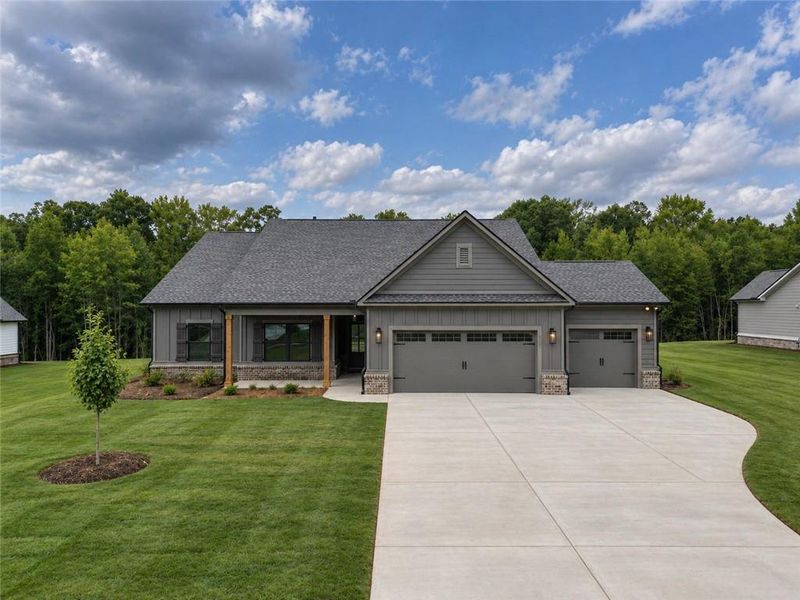Front exterior of a new home in Weslyn Park, Social Circle, GA, highlighting curb appeal (Image 21).