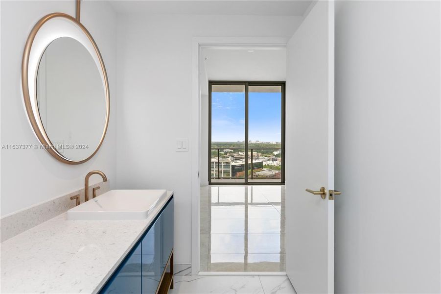 Primary bath and bedroom view.