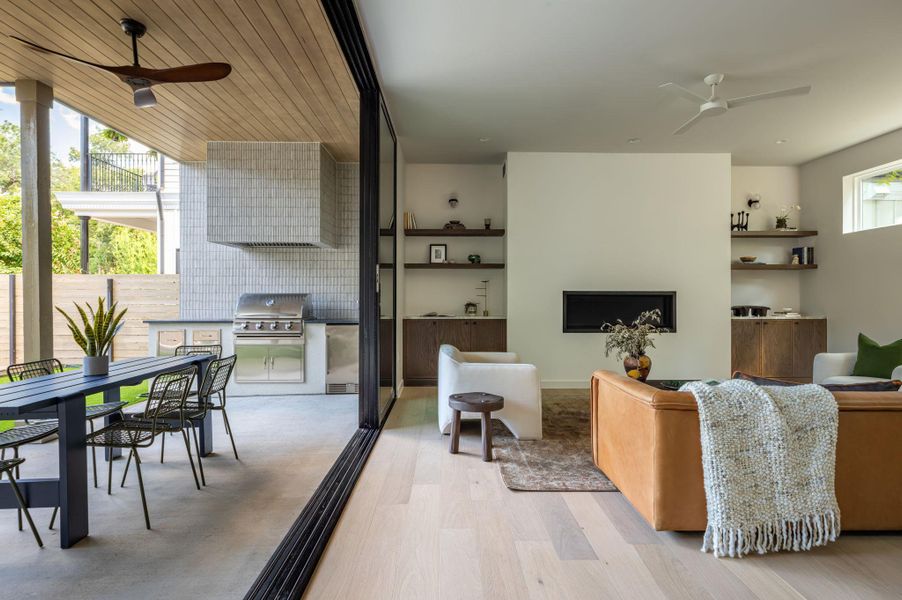 A seamless connection transitions this main living space directly to the covered patio kitchen. A seamless connection transitions this main living space directly to the covered patio kitchen.