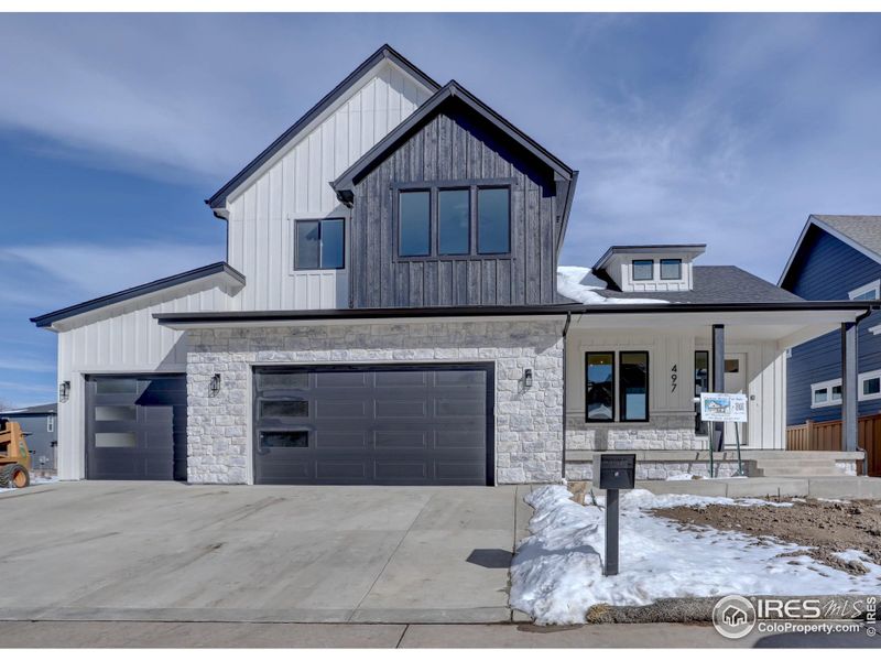 Front exterior of a new home in , Louisville, CO, highlighting curb appeal (Image 1).