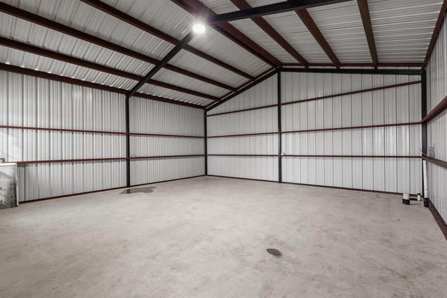 Garage featuring metal wall