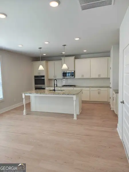Furnished interior view inside a new home in The Fairways at Mirror Lake, Villa Rica (Image 4).