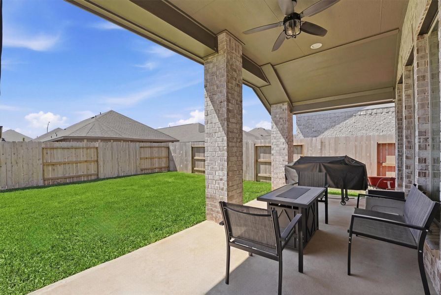 Fenced backyard with patio