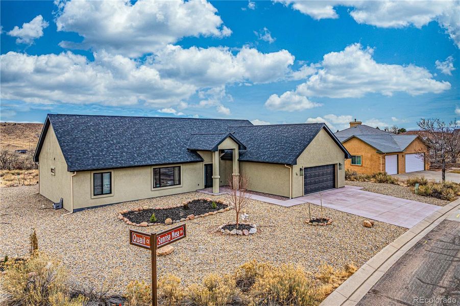 Front exterior of a new home in , Cañon City, CO, highlighting curb appeal (Image 2). Front exterior of a new home in , Cañon City, CO, highlighting curb appeal (Image 2).