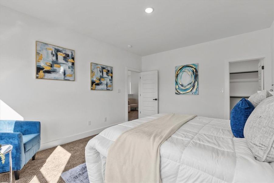 Carpeted bedroom featuring baseboards Carpeted bedroom featuring baseboards