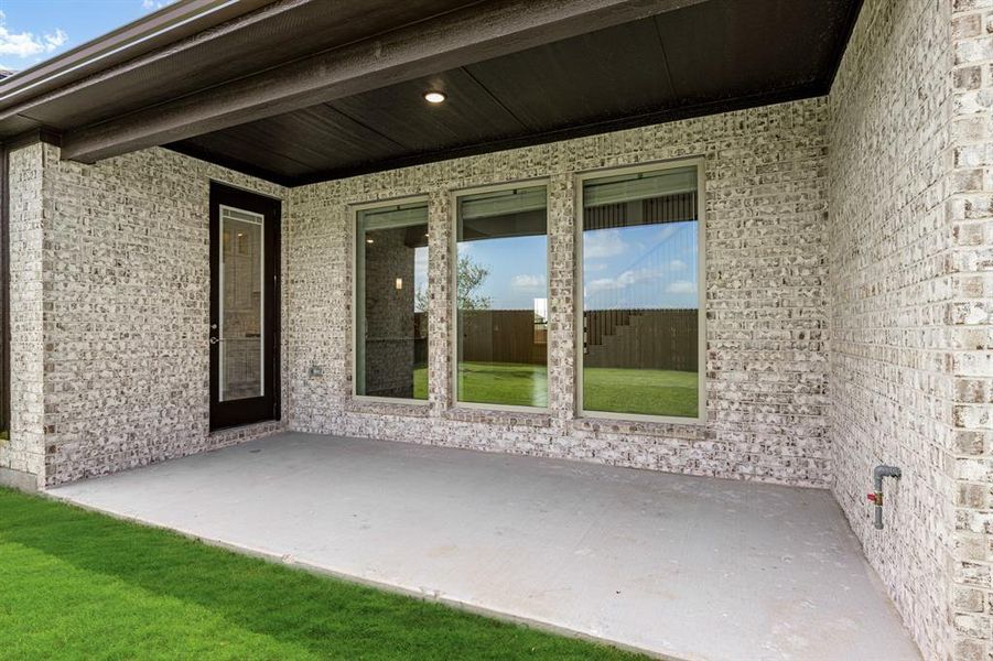 Exterior details and patio area of a home in Wildflower Ranch 60-65, Justin (Image 4). Exterior details and patio area of a home in Wildflower Ranch 60-65, Justin (Image 4).
