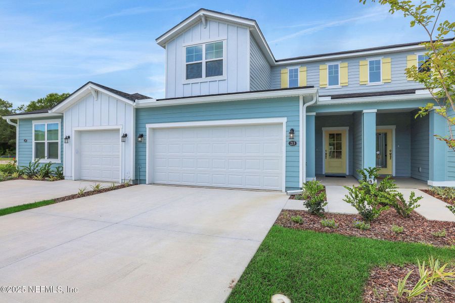Front exterior of a new home in The Hammock at Palm Harbor, Palm Coast, FL, highlighting curb appeal (Image 16).