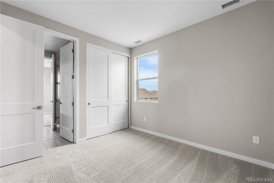 Spacious, unfurnished interior of a new home in Tribute at Lyric, Lone Tree (Image 25).