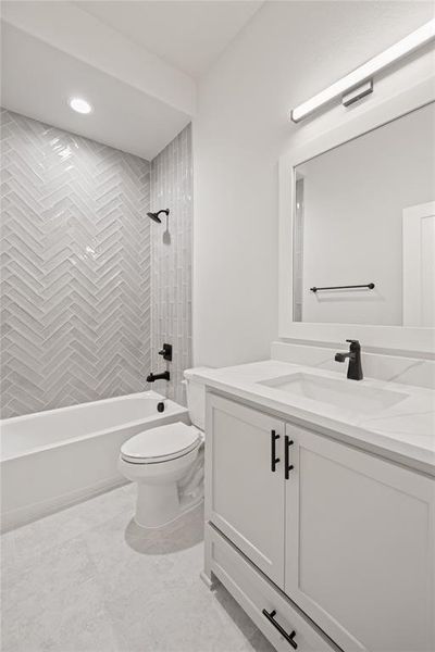 Contemporary bathroom featuring a white vanity with matte black hardware, an integrated sink, and a white countertop