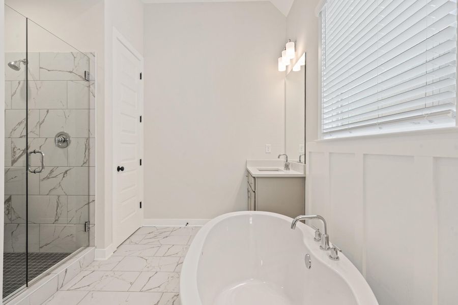 Freestanding soaking tub with chrome fixtures Freestanding soaking tub with chrome fixtures