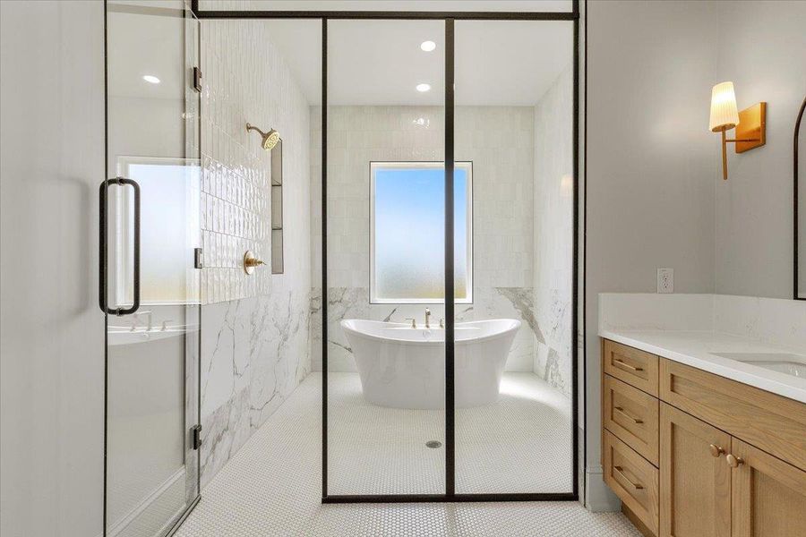 Indulge in a spa-like retreat with this luxurious bath, showcasing a freestanding tub and a spacious walk-in shower. Indulge in a spa-like retreat with this luxurious bath, showcasing a freestanding tub and a spacious walk-in shower.