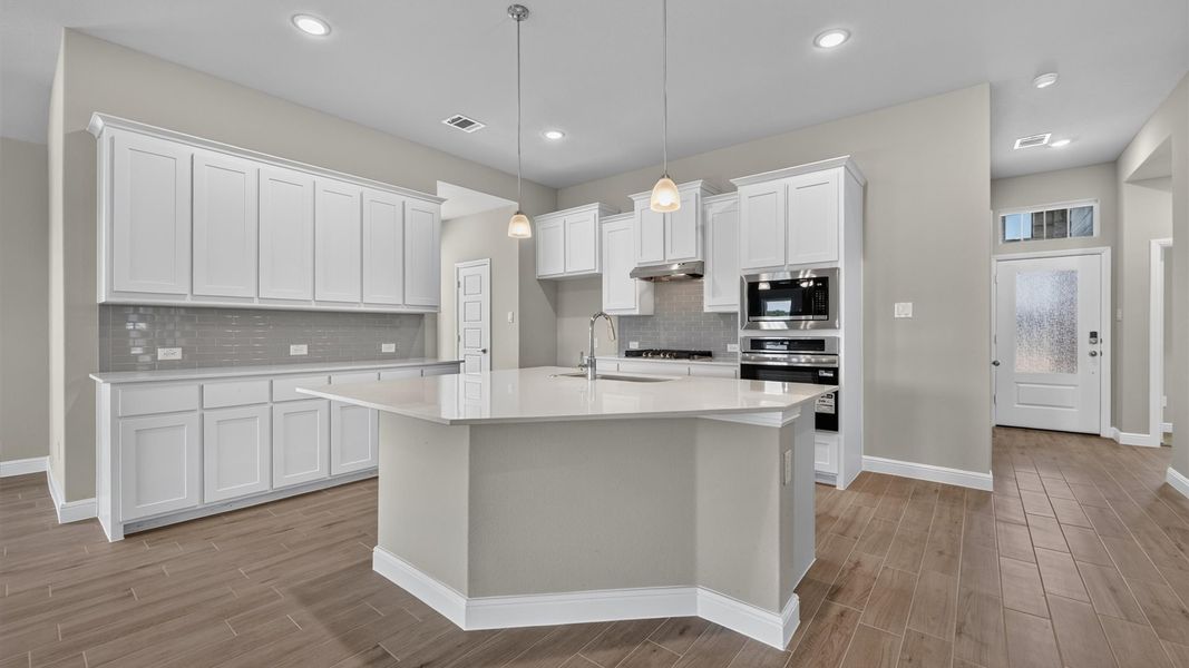 Representative furnished interior of a home built from the Desert Willow by D.R. Horton in Treeline, Justin (Image 7).
