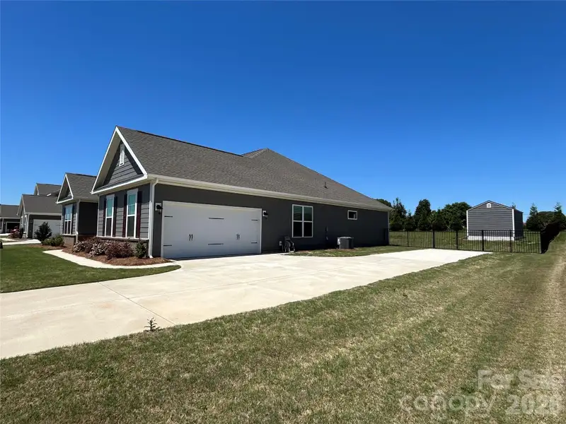 Front exterior of a new home in Yorkshire Farms, Salisbury, NC, highlighting curb appeal (Image 2). Front exterior of a new home in Yorkshire Farms, Salisbury, NC, highlighting curb appeal (Image 2).