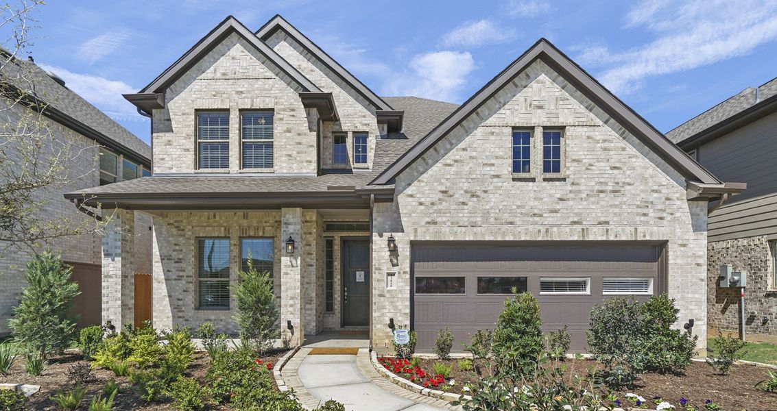 Front exterior of a new home in Wood Leaf Reserve, Tomball, TX, highlighting curb appeal (Image 24).