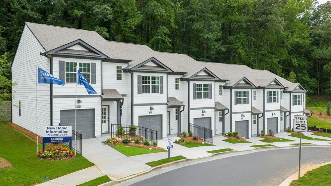 Front exterior of a new home in Towns at Monroe, Atlanta, GA, highlighting curb appeal (Image 20). Front exterior of a new home in Towns at Monroe, Atlanta, GA, highlighting curb appeal (Image 20).