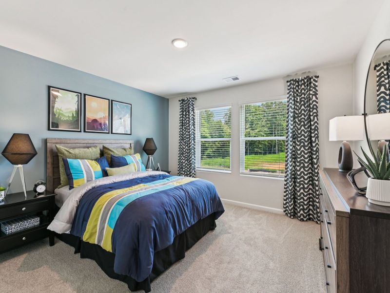 Secondary bedroom in the Taylorsville floorplan at a Meritage Homes community in Mebane, NC. Secondary bedroom in the Taylorsville floorplan at a Meritage Homes community in Mebane, NC.