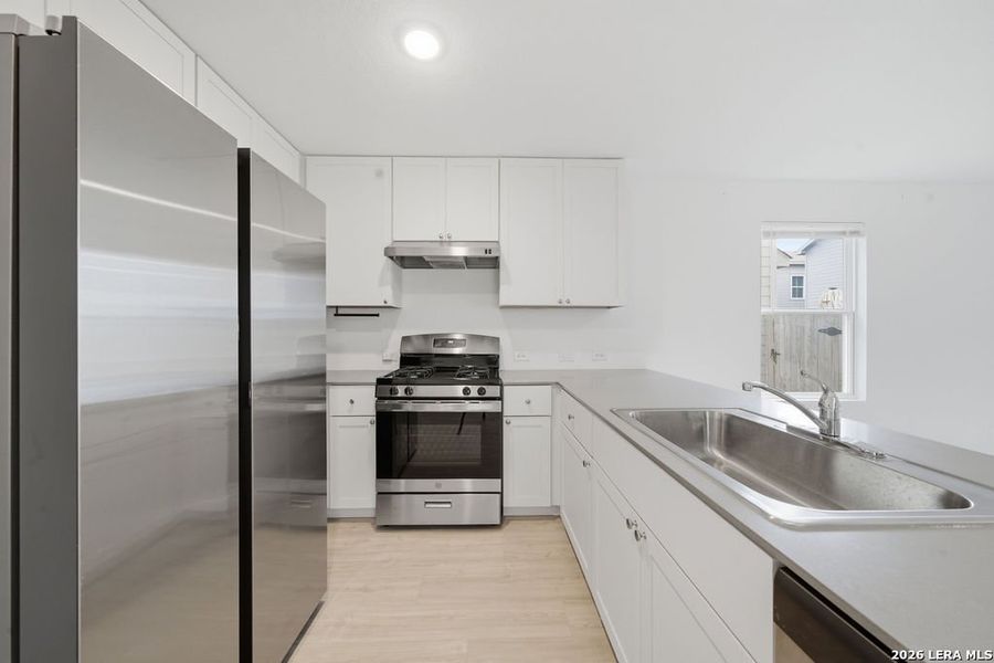 Furnished interior view inside a new home in Aston Park, San Antonio (Image 9).
