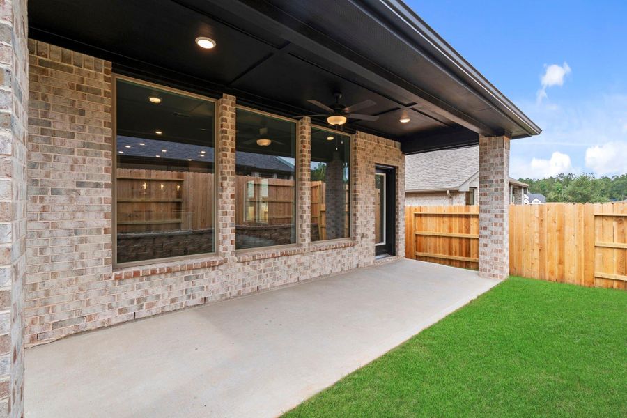 Exterior details and patio area of a home in Wildtree, Magnolia (Image 3).