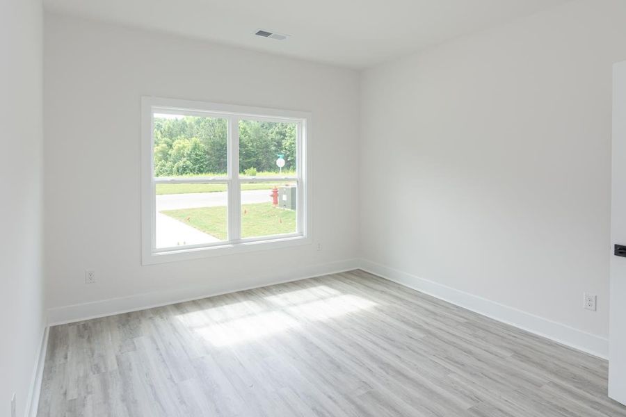 Representative unfurnished interior of a home built from the 1692 Townhome by Adams Homes in Parkstone Place Townhomes, Roebuck (Image 15).