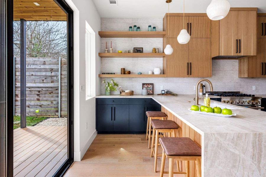 Charming open shelving and island seating