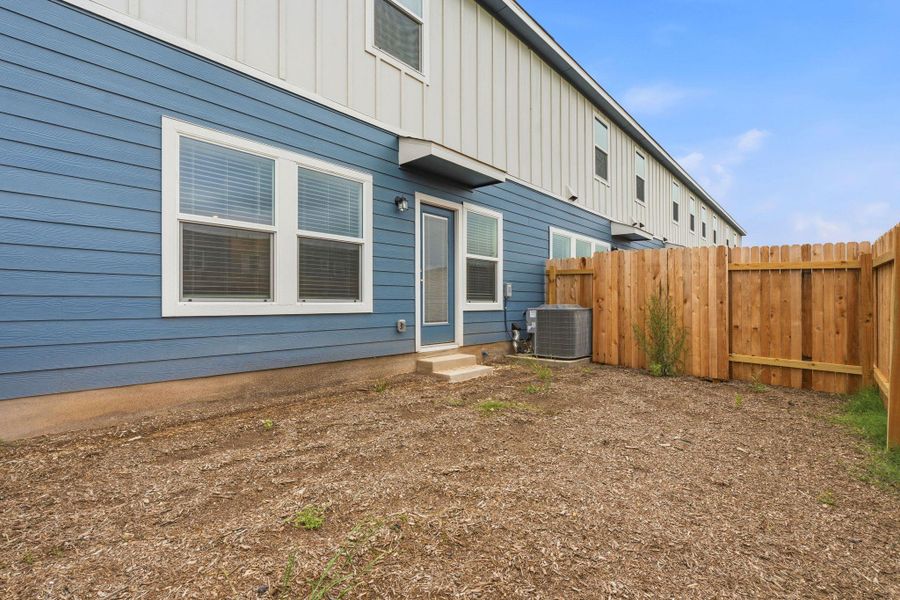Exterior featuring blue siding and white trim Exterior featuring blue siding and white trim