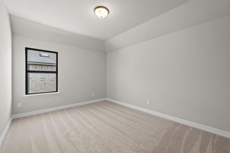 Your secondary bedroom features plush carpet, fresh paint, closet, and a large window that lets in plenty of natural lighting.