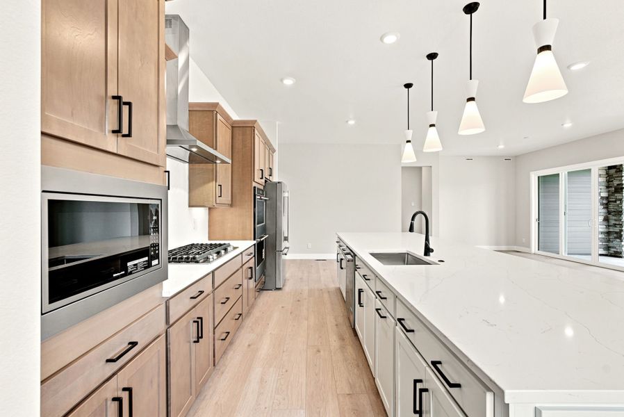 Furnished interior view inside a new home in Hilltop at Inspiration, Aurora (Image 5).