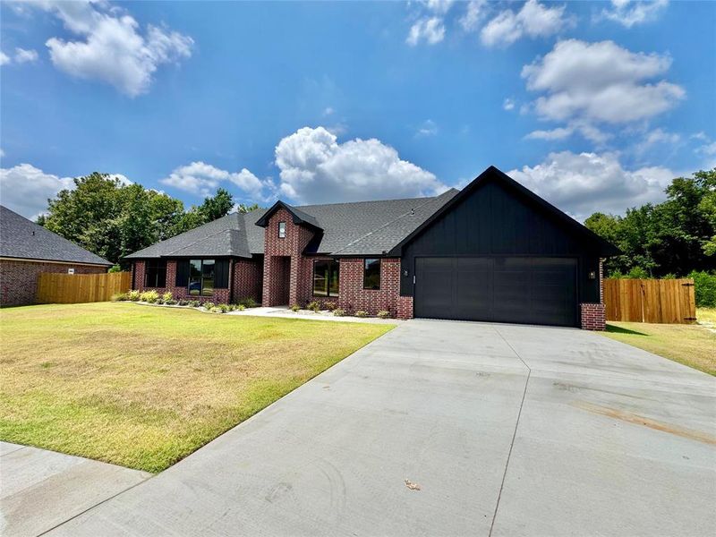 Front exterior of a new home in , Lindale, TX, highlighting curb appeal (Image 26). Front exterior of a new home in , Lindale, TX, highlighting curb appeal (Image 26).