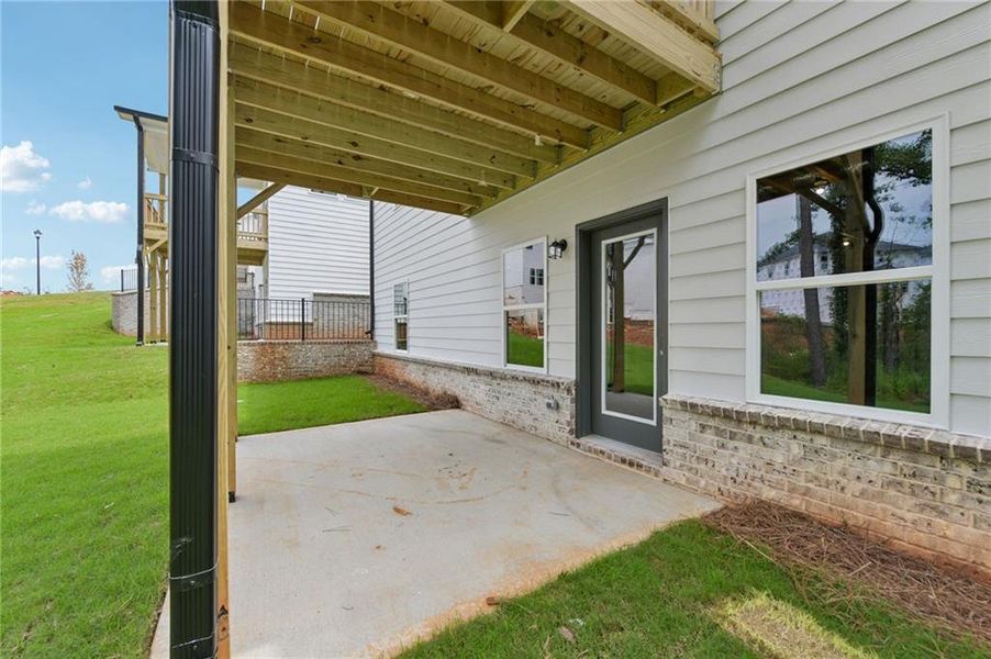Exterior details and patio area of a home in Martin Springs - Estate Series, Lawrenceville (Image 28).