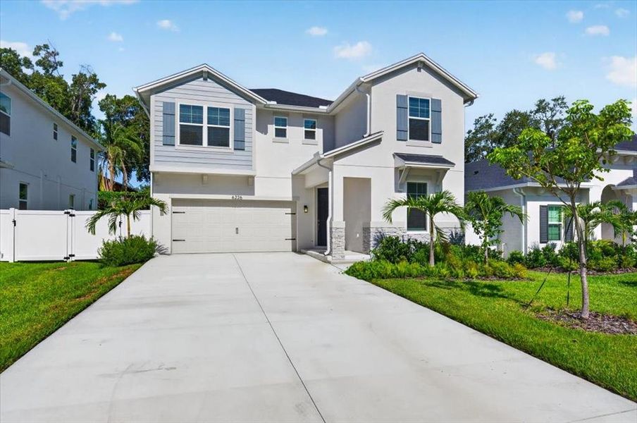 Front exterior of a new home in , St. Petersburg, FL, highlighting curb appeal (Image 1). Front exterior of a new home in , St. Petersburg, FL, highlighting curb appeal (Image 1).