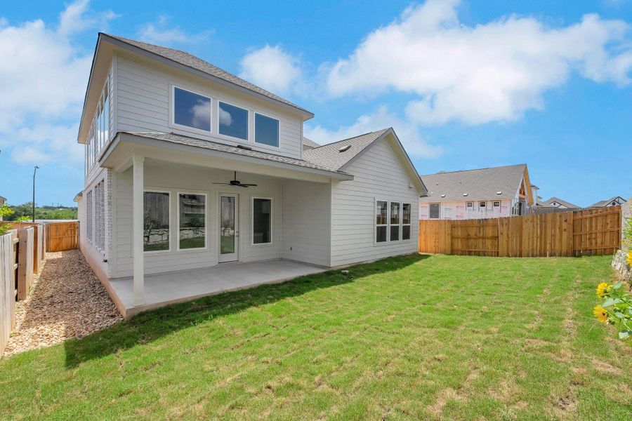Rear view of property with ceiling fan, a fenced backyard, a patio area, and a shingled roof Rear view of property with ceiling fan, a fenced backyard, a patio area, and a shingled roof