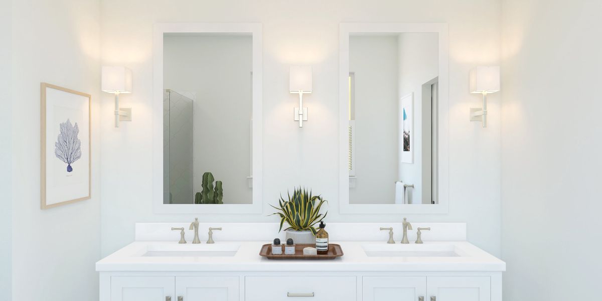 Primary bath with freestanding vanity and brushed nickel faucets