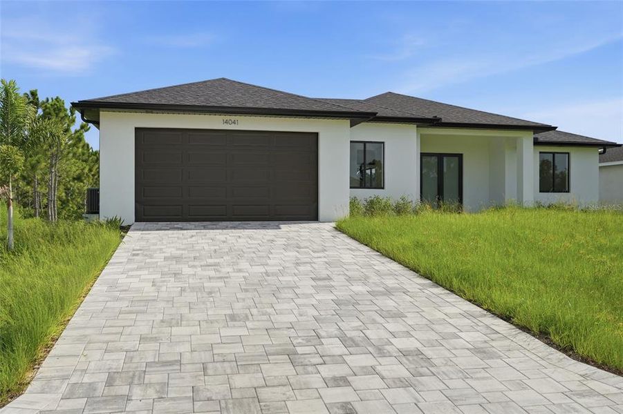 Front exterior of a new home in , Port Charlotte, FL, highlighting curb appeal (Image 18). Front exterior of a new home in , Port Charlotte, FL, highlighting curb appeal (Image 18).