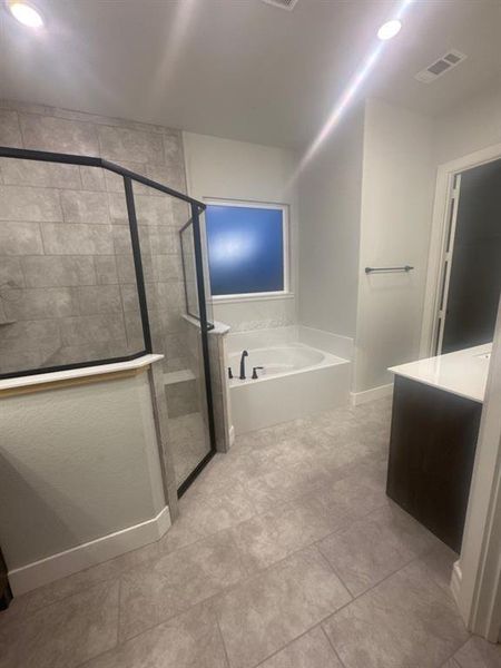 Full bath featuring a bath, vanity, a stall shower, and recessed lighting