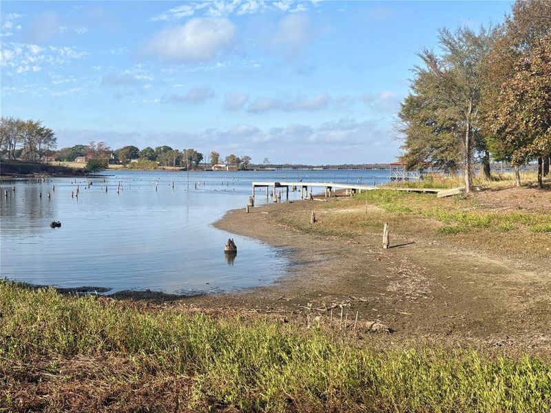 Water view featuring a dock