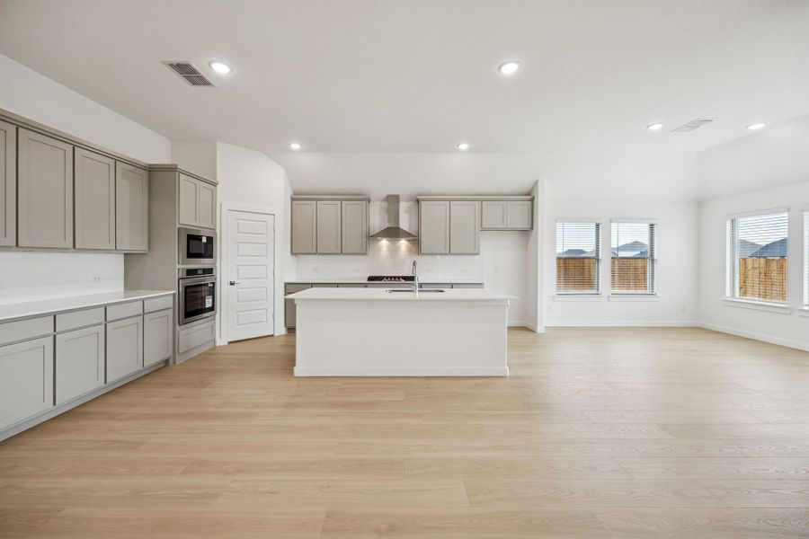 Kitchen in the Gilmour II home plan by Trophy Signature Homes – REPRESENTATIVE PHOTO (sterling)