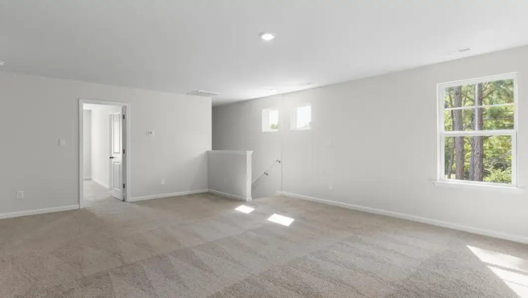 Spacious, unfurnished interior of a new home in The Highlands at Cedar Hill Landing, Navassa (Image 25).