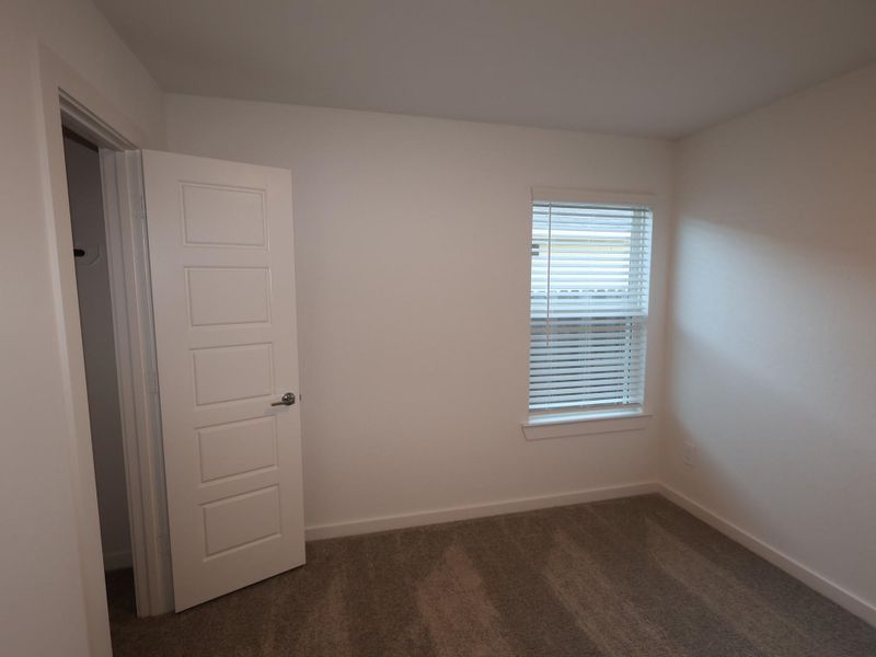 Spacious, unfurnished interior of a new home in Pinewood at Grand Texas, New Caney (Image 30).