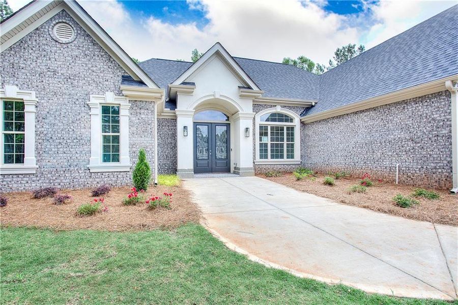 Front exterior of a new home in , Conyers, GA, highlighting curb appeal (Image 24). Front exterior of a new home in , Conyers, GA, highlighting curb appeal (Image 24).